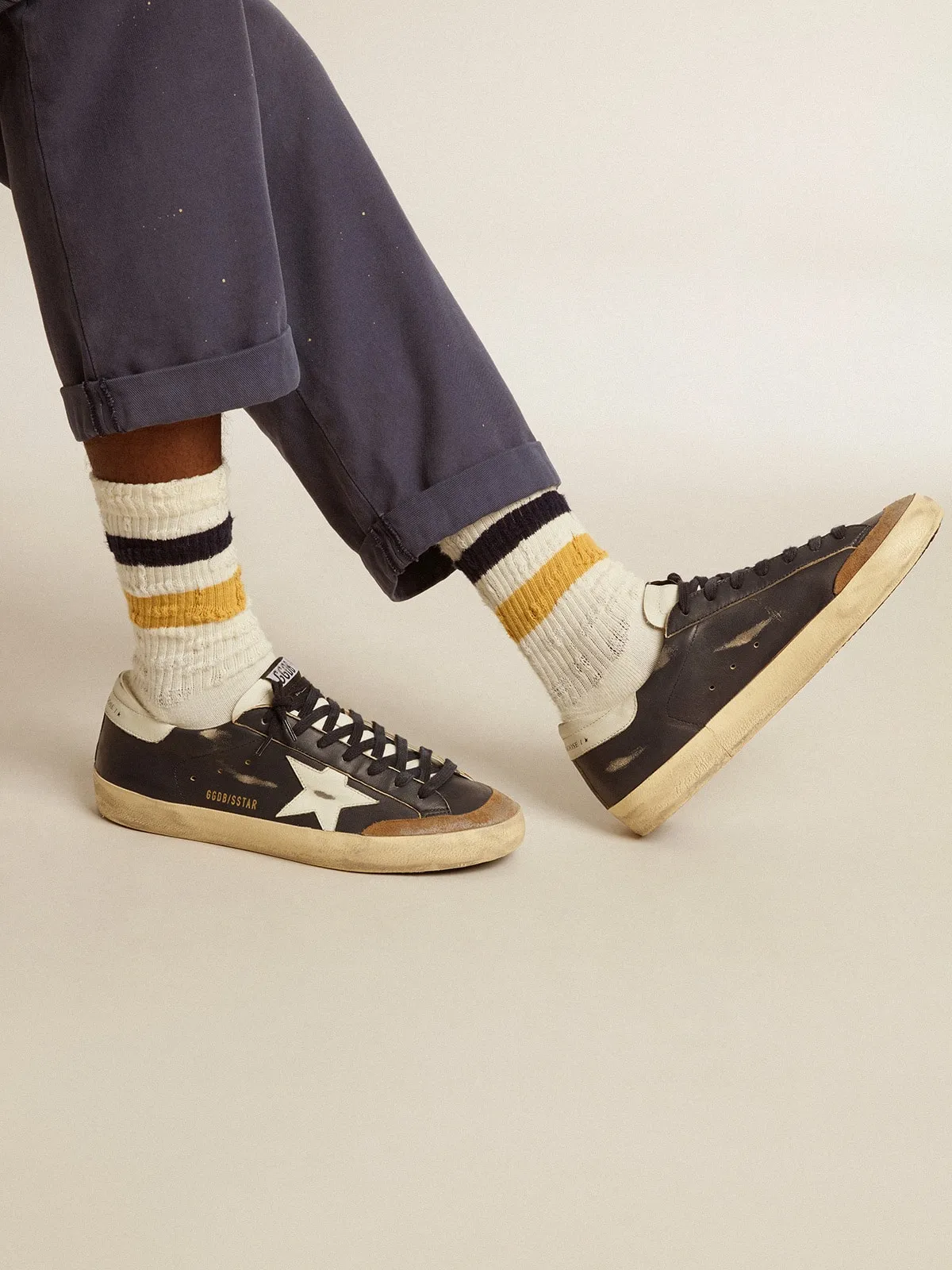 Aged-white socks with distressed details and two-tone stripes