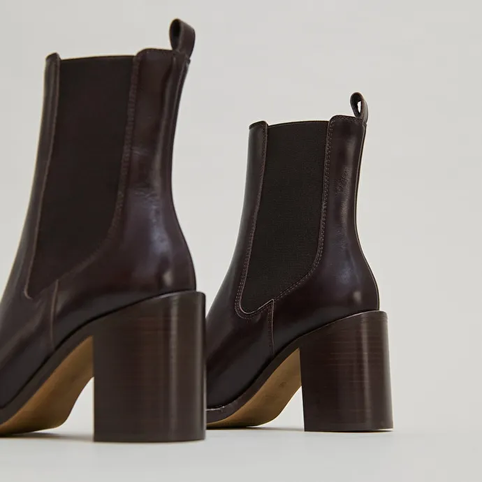 Ankle boots with overflowing heels in dark brown leather