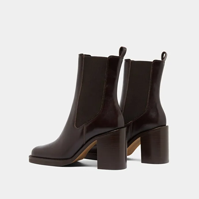 Ankle boots with overflowing heels in dark brown leather